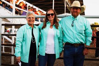 Left to right: Wolf Point's Christy Stensland, Nicole Paulson and JD Stensland pause between events at the Wild Horse Stampede rodeo Saturday, July 11, 2020.